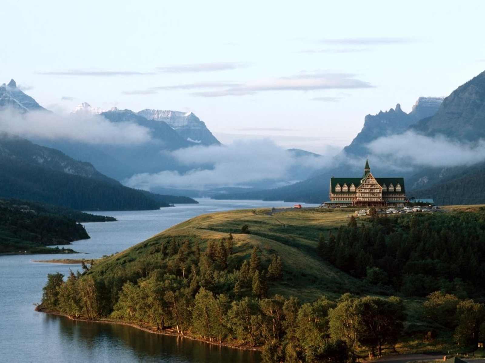 A wide shot of Waterton Lakes National Park, showing the lake and surrounding mountains.